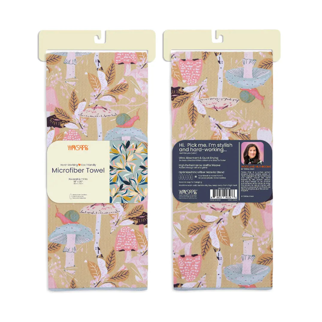 Two microfiber kitchen towels featuring a tan background with pink mushrooms, green snails, and brown foliage patterns.