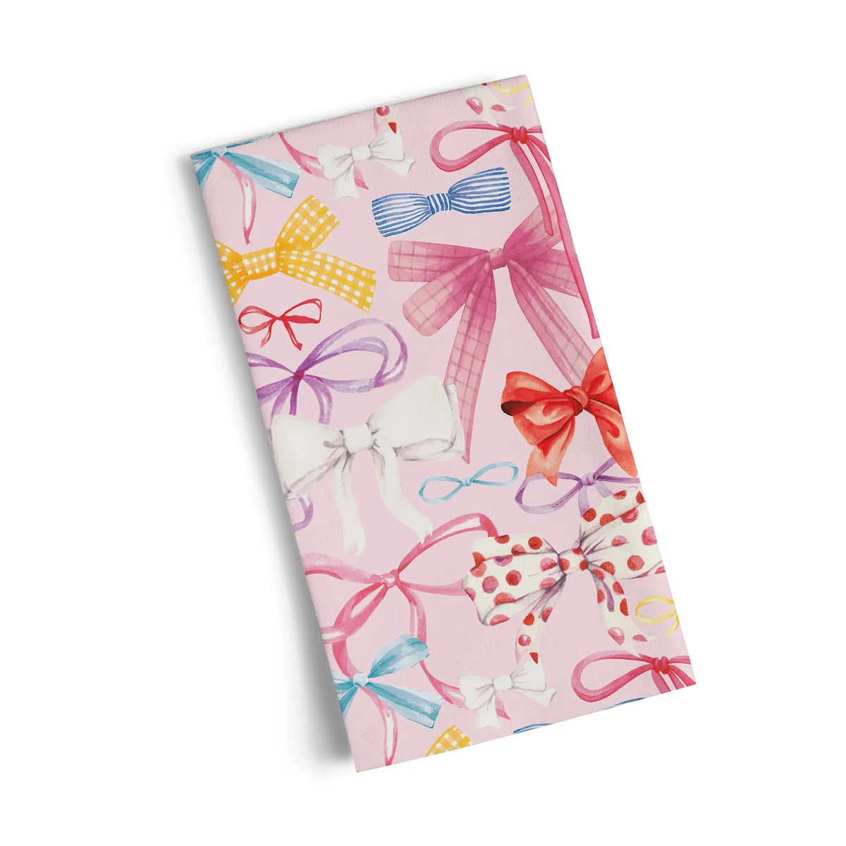 Cotton tea towel with a light pink background featuring a pattern of colorful, whimsical hand-painted ribbons and bows.