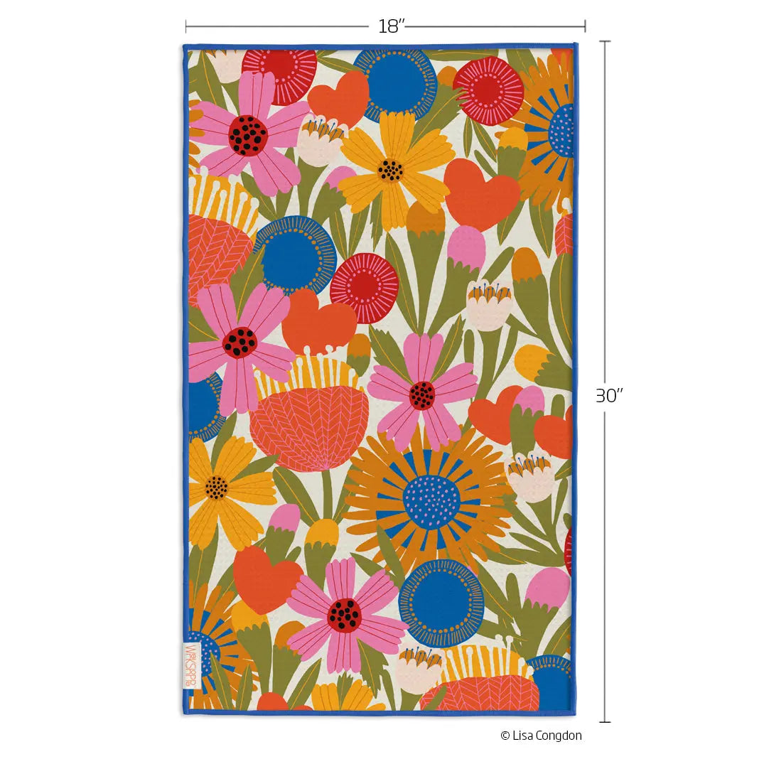 Microfiber kitchen towel with a vibrant, colorful floral pattern on a cream background and blue piped edges.