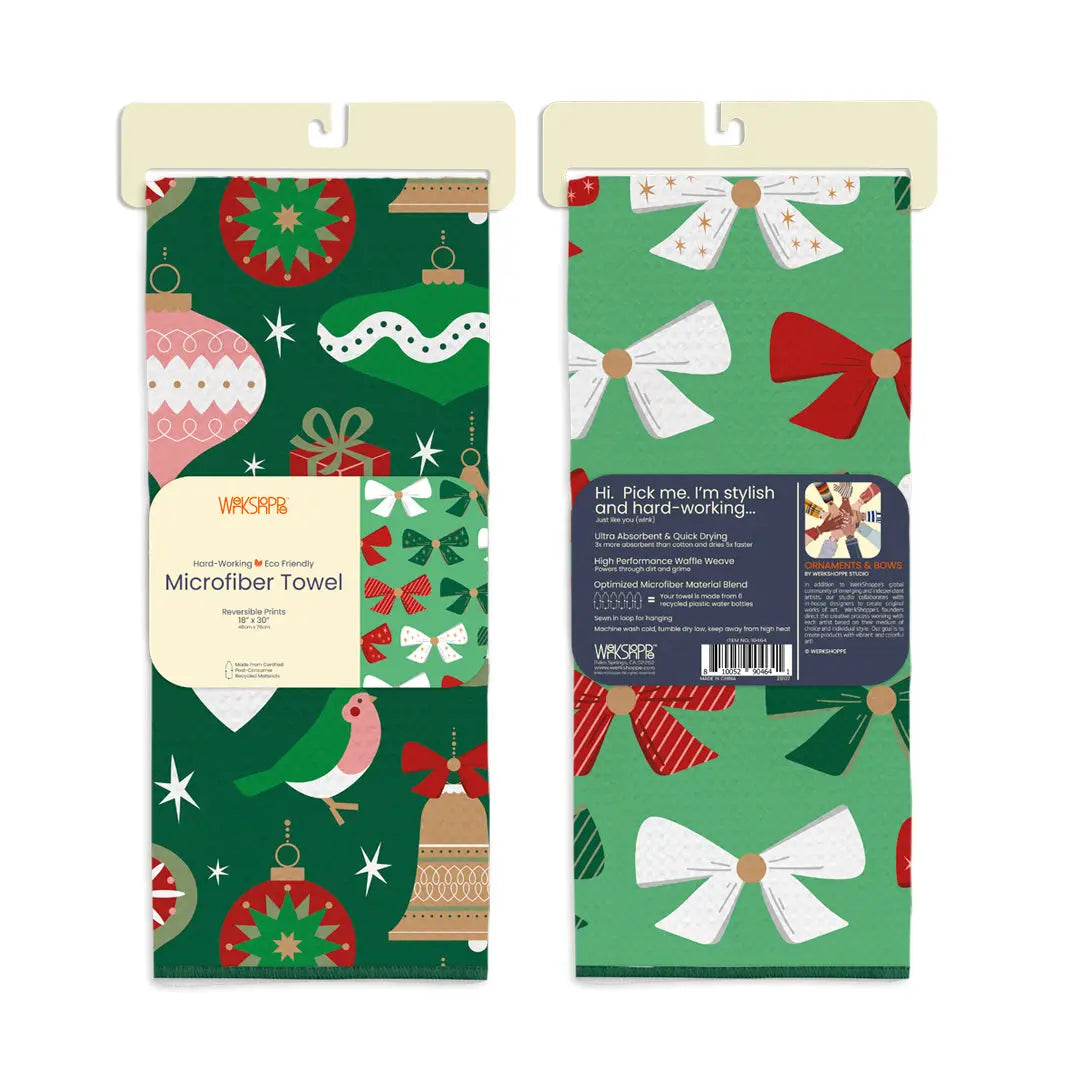Green microfiber towels featuring holiday patterns of Christmas ornaments, bells, robins, and white and red bows.