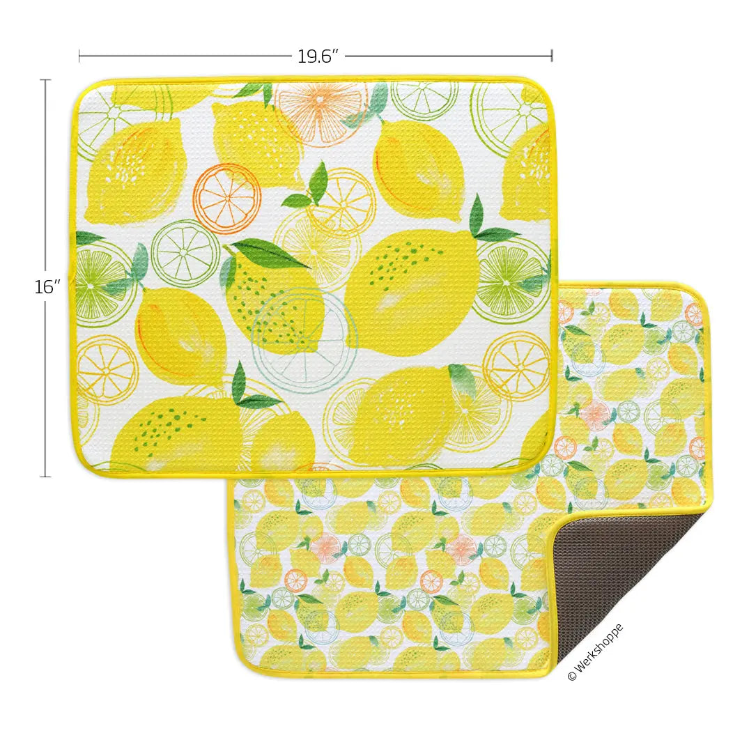 Two rectangular dish drying mats featuring yellow lemon and citrus slice patterns with yellow edges and waffle texture.