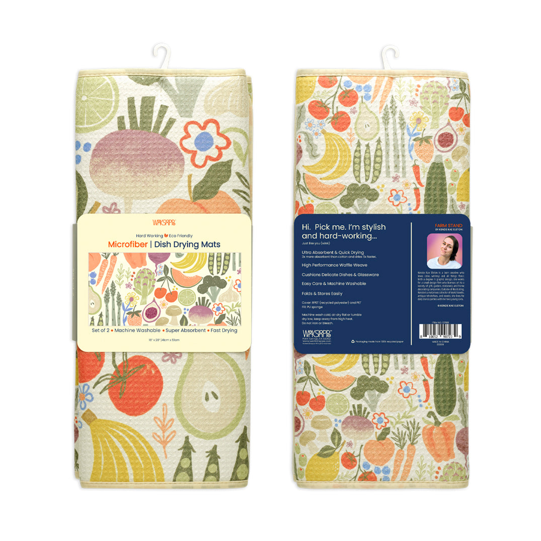 Two rectangular microfiber dish drying mats with a cream background and a colorful print of various fruits and vegetables.
