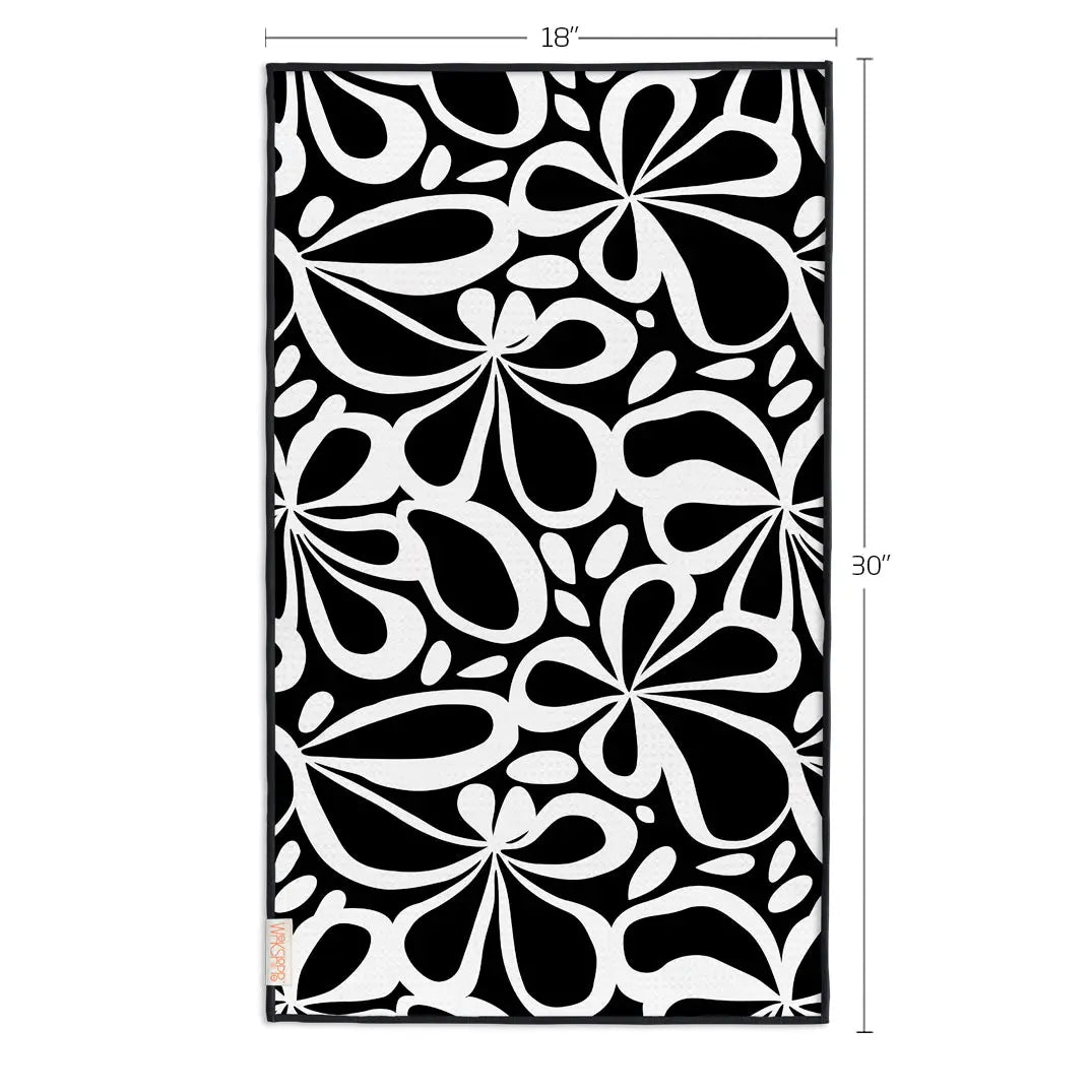 Microfiber towel with black and white retro floral tile pattern, measuring 18 by 30 inches.