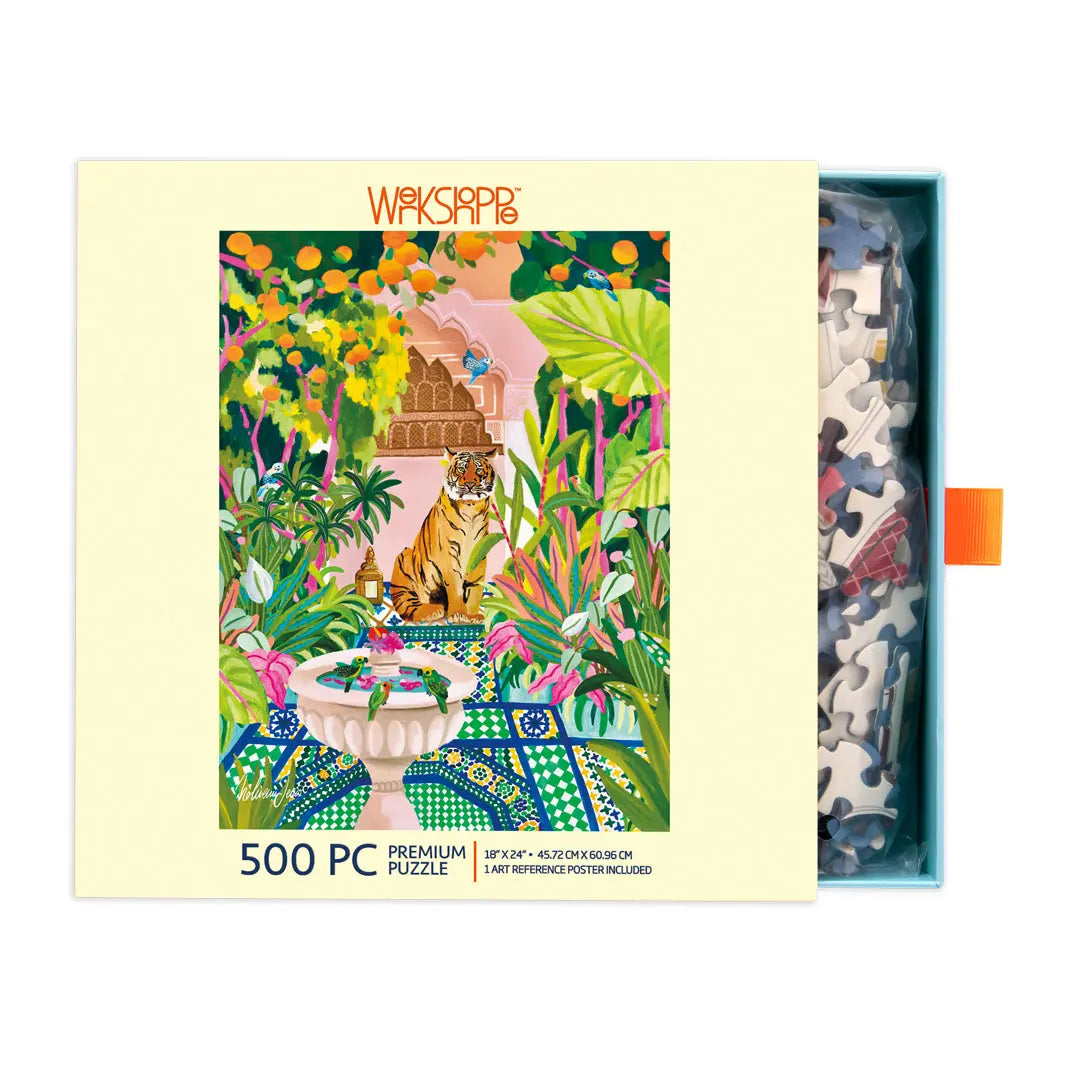 500-piece puzzle box featuring a colorful, vibrant tiger in a lush, patterned garden oasis with a fountain.