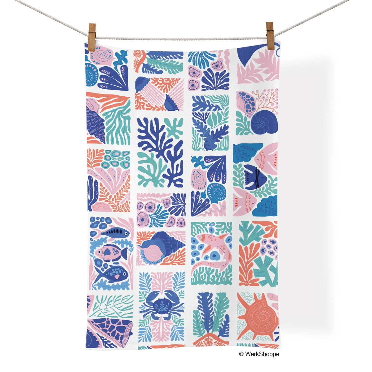 Cotton tea towel with a grid pattern of modern coastal illustrations in blue, coral, and pink.