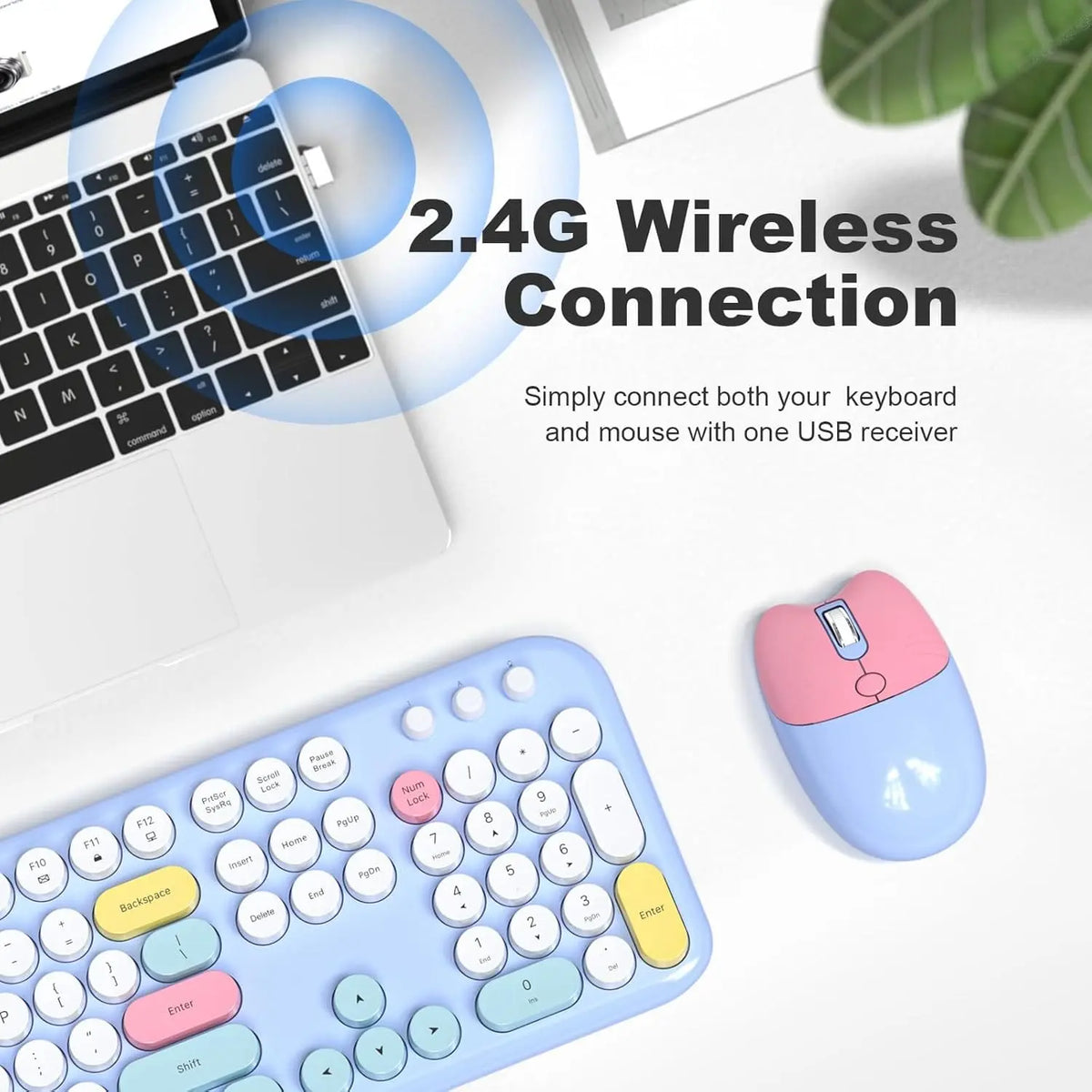 Pastel blue wireless keyboard with round, multicolored keys and a matching pink and blue cat-shaped mouse on a desk.