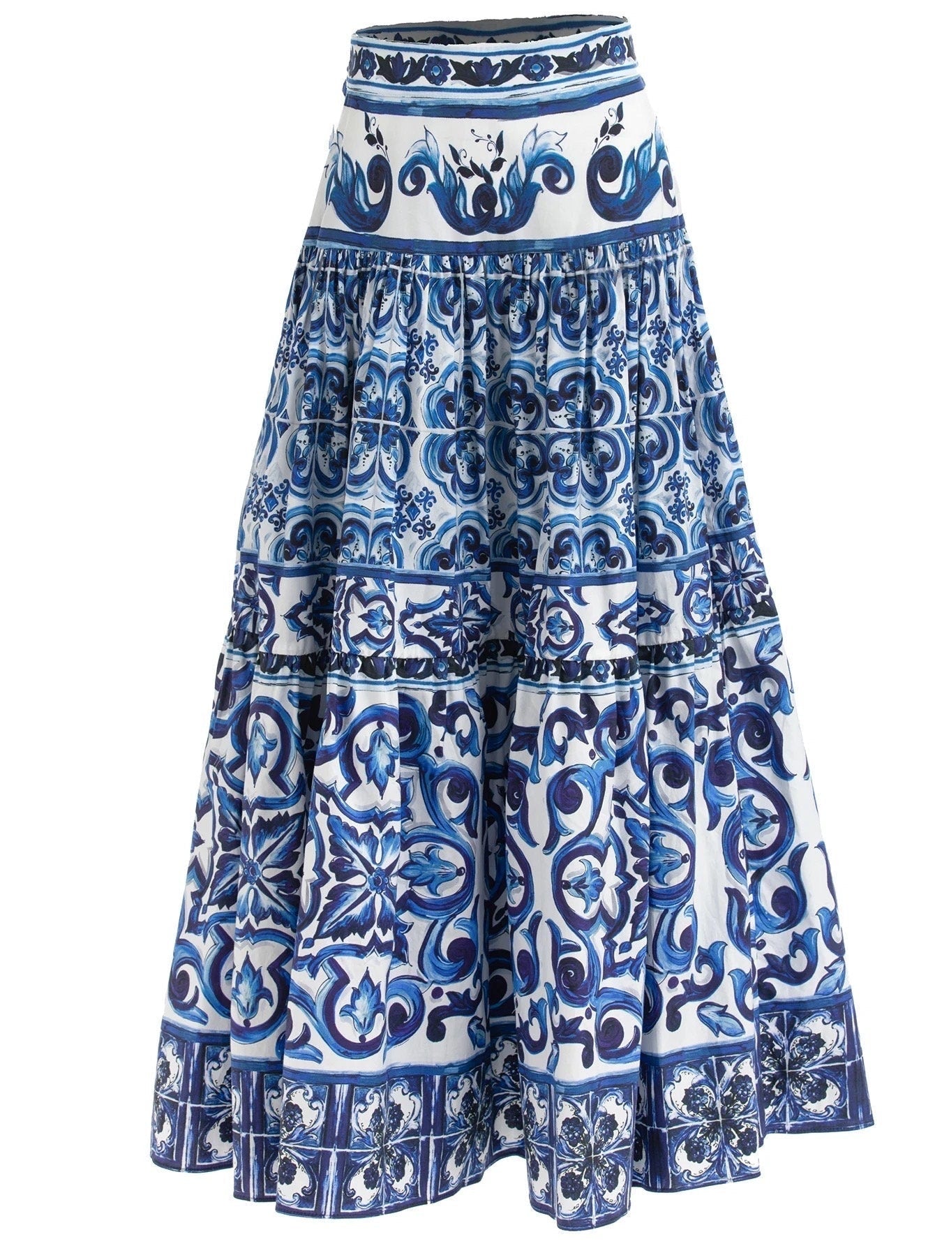 Maxi cotton skirt with blue and white Majolica porcelain tile print, tiered design, and a high-waisted silhouette.