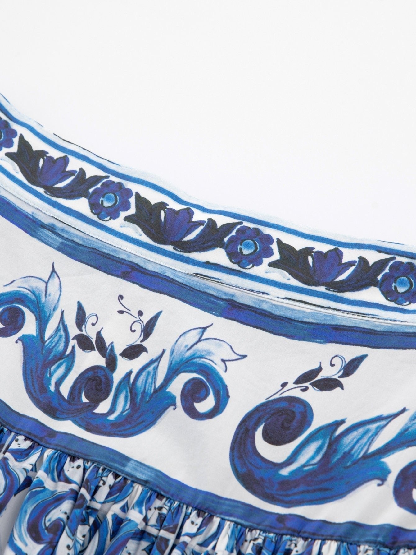 Cotton maxi skirt with blue and white Majolica porcelain-inspired floral and scroll print and gathered waistband.