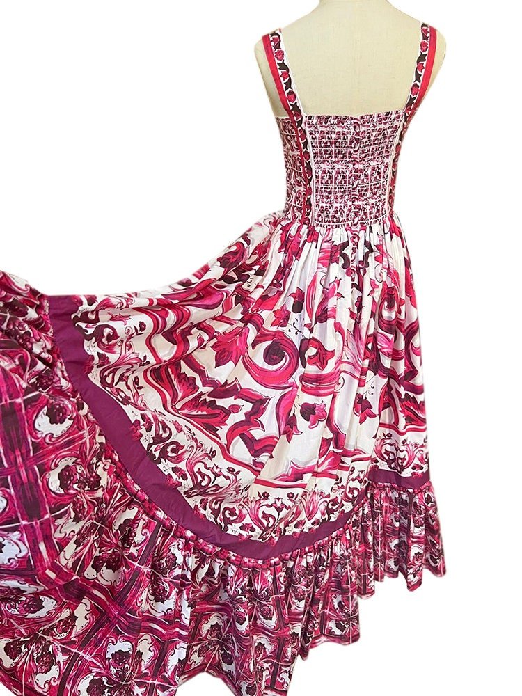 Pink and white floral maxi dress with a smocked bodice and ruffled hem, perfect for summer outings.