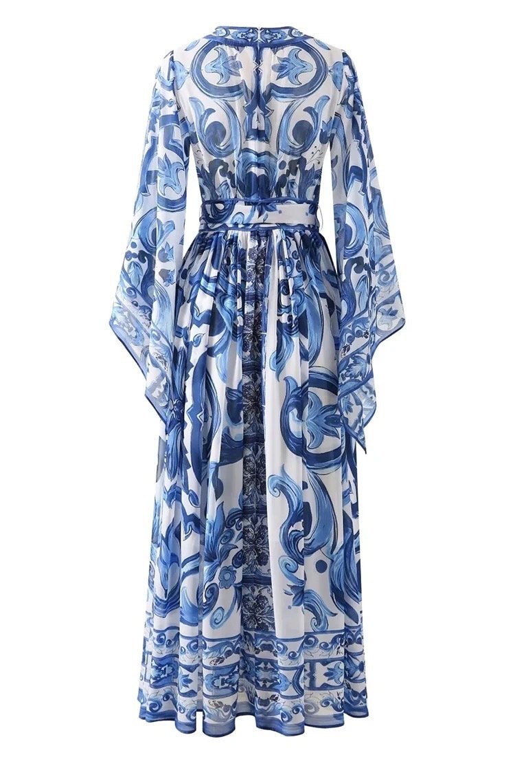 Blue and white floral printed maxi dress with long sleeves and a belted waist, perfect for elegant summer occasions.