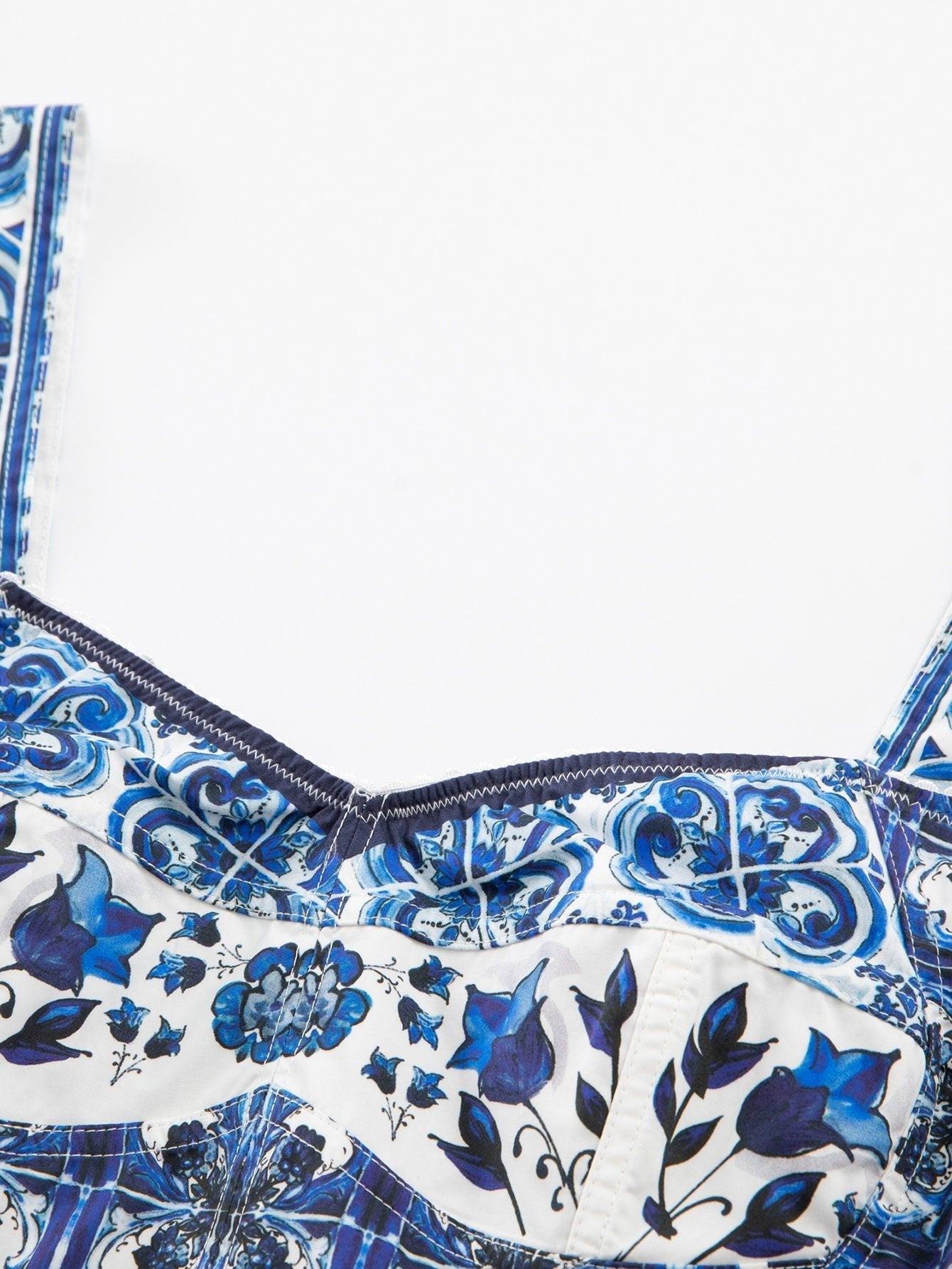 Bustier top in white cotton with a blue and pink Italian Majolica tile and floral print, featuring thick straps.