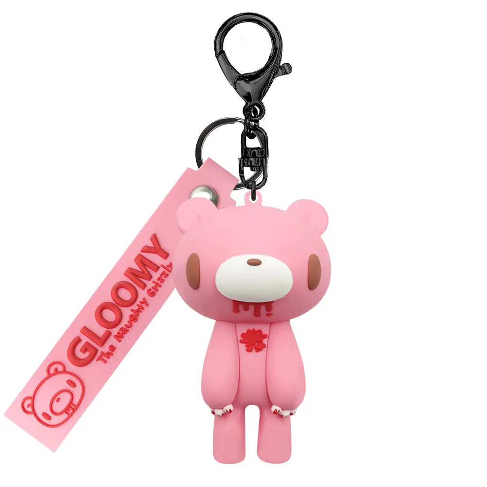 Pink Gloomy Bear figure keychain with red blood details, a branded rubber strap, and a black metal clasp.
