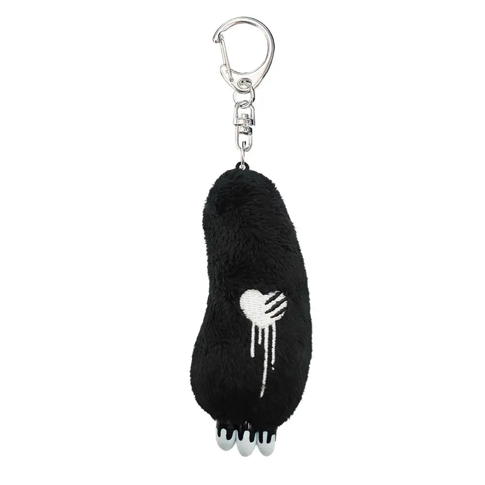 Gloomy Bear plush keychain in black fuzzy material featuring a white embroidered dripping heart and three white claws.