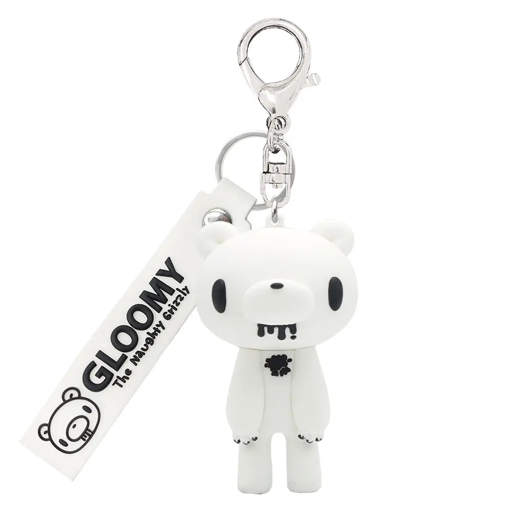 White Gloomy Bear keychain with a dangling branded tag and silver clasp. Matte finish with black details.