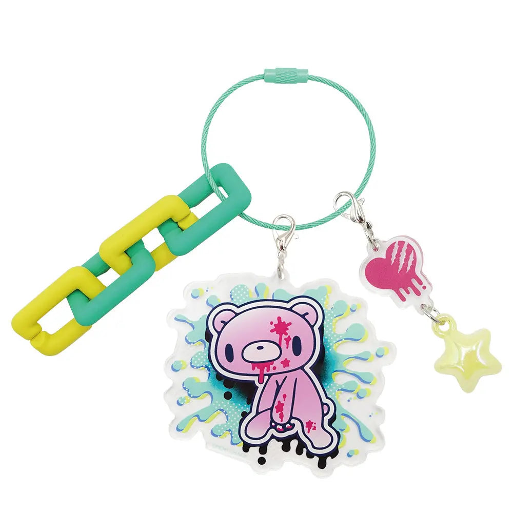 Gloomy Bear acrylic keychain with graffiti background, a plastic chain, and dangling heart and star charms.