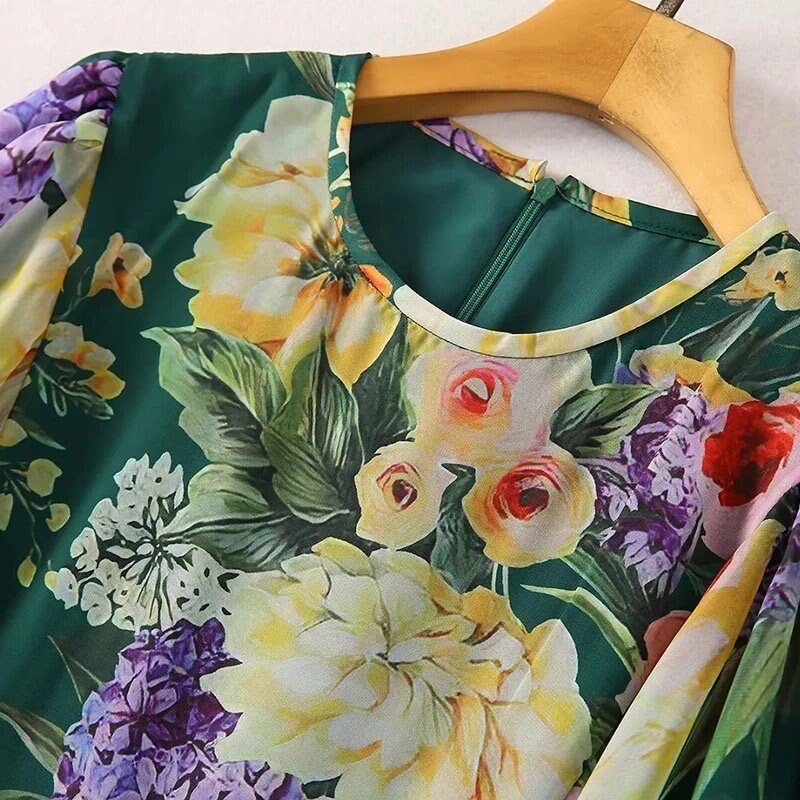 Floral print green blouse with vibrant colors, round neck, and soft fabric, perfect for spring and summer outfits.