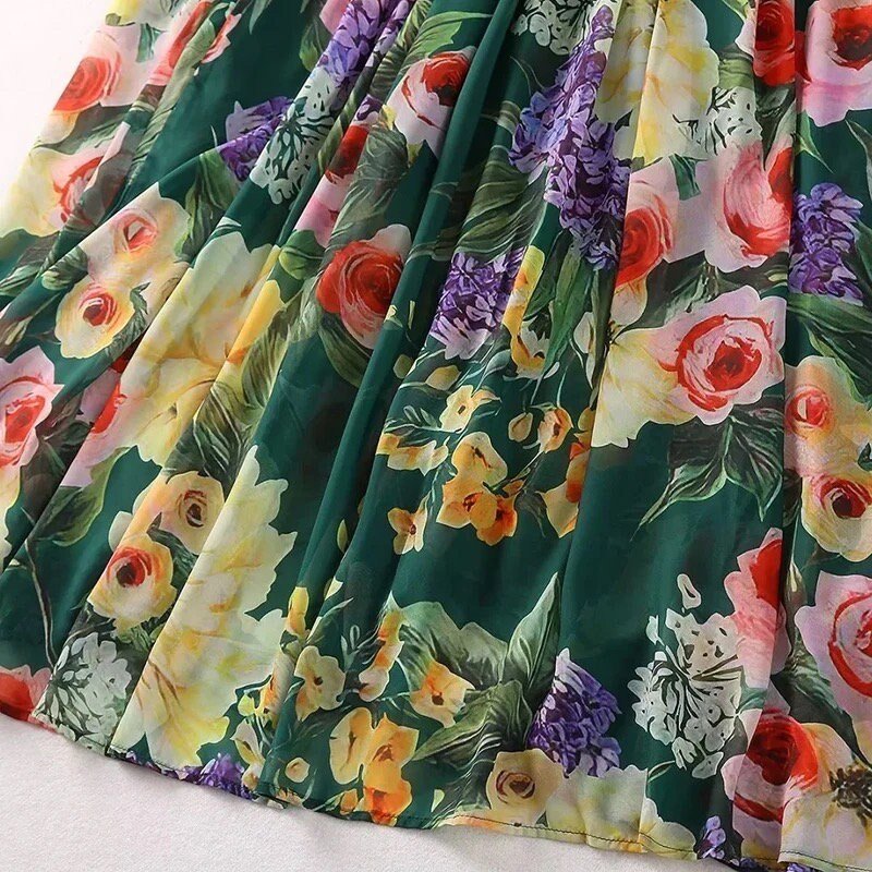 Floral print chiffon dress in green, featuring pink roses and colorful blooms, perfect for spring and summer styles.