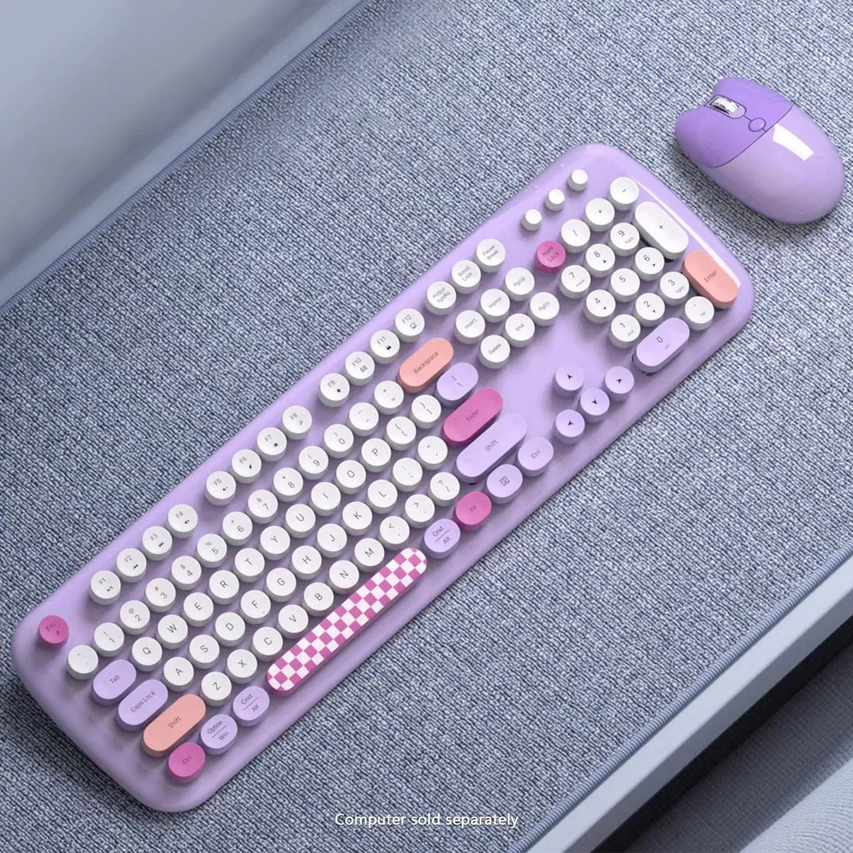 Lavender wireless keyboard and mouse set with round white keys, pink accents, and a checkered space bar.