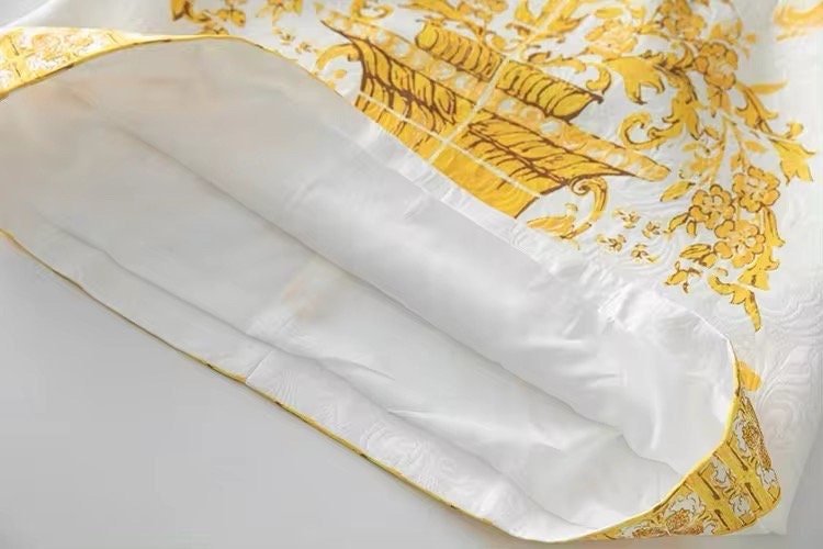 Luxurious yellow and white floral silk cushion cover with intricate boat design, perfect for elegant home decor.