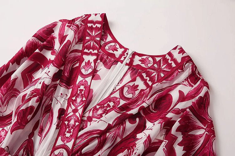 Pink and white patterned maxi dress, featuring floral designs and a zip closure, perfect for summer outings.
