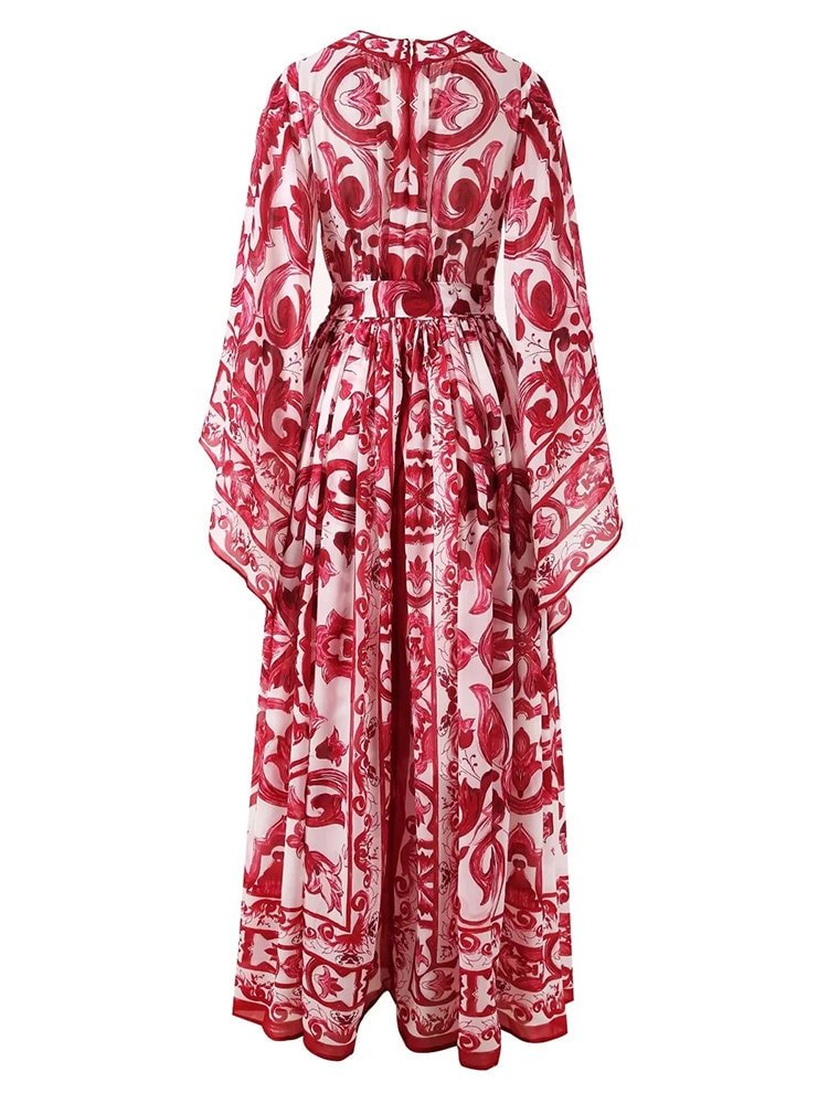 Red and white floral print maxi dress with long sleeves and a cinched waist, crafted from lightweight fabric.