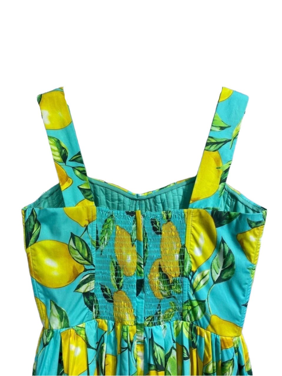 Vibrant turquoise dress with lemon print, smocked bodice, and wide straps, perfect for summer outings.