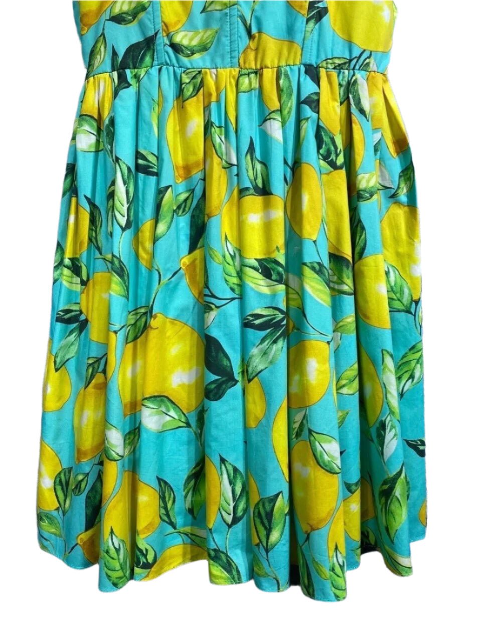Turquoise lemon print cotton dress with vibrant yellow fruits and green leaves, perfect for summer outings.