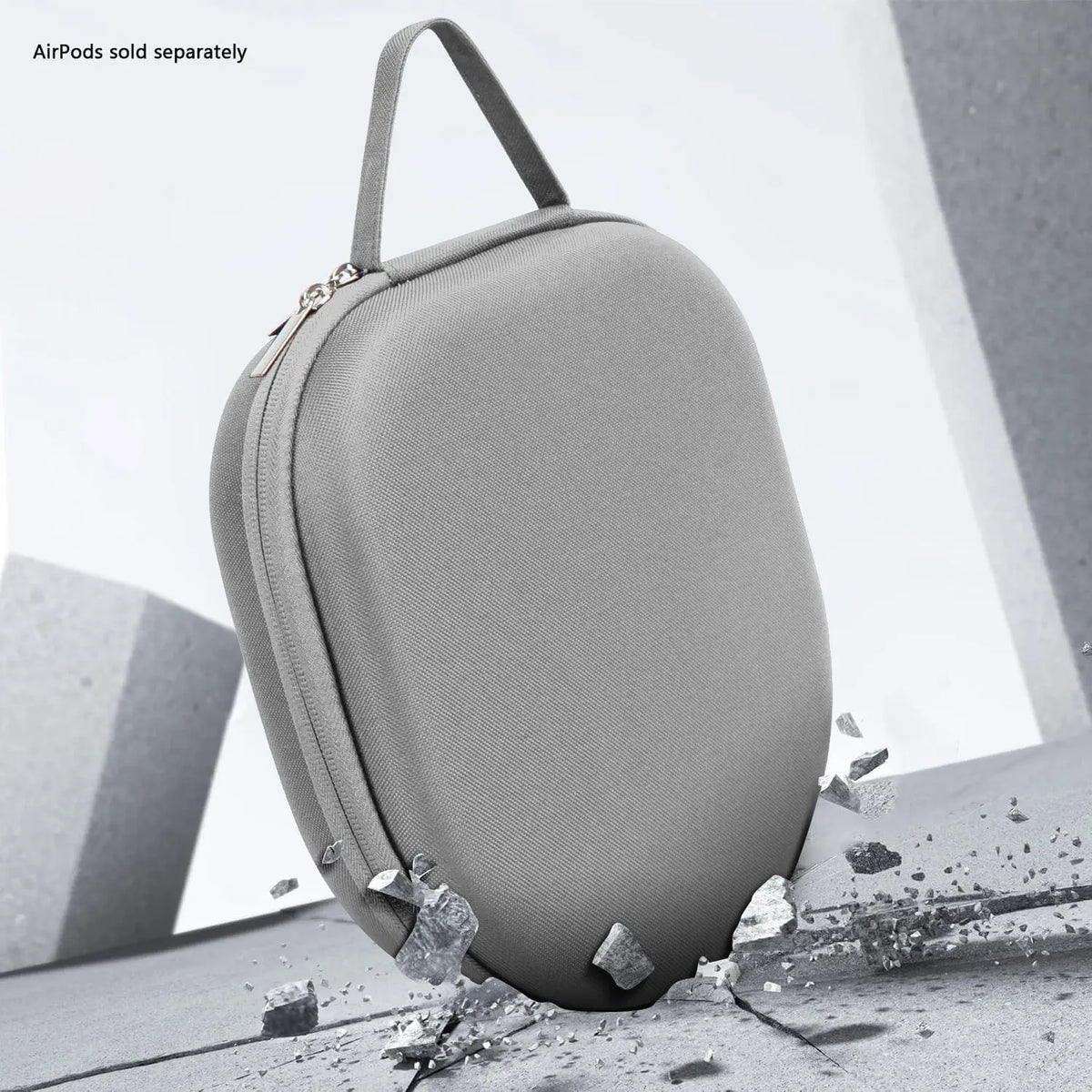Gray hard-shell travel carry case for AirPods Max with a top handle, zipper closure, and durable textured finish.