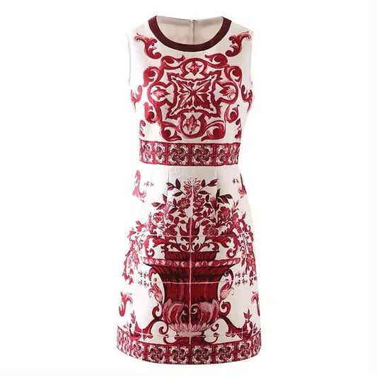 Red and white sleeveless dress with intricate floral and baroque prints, crafted from lightweight fabric.