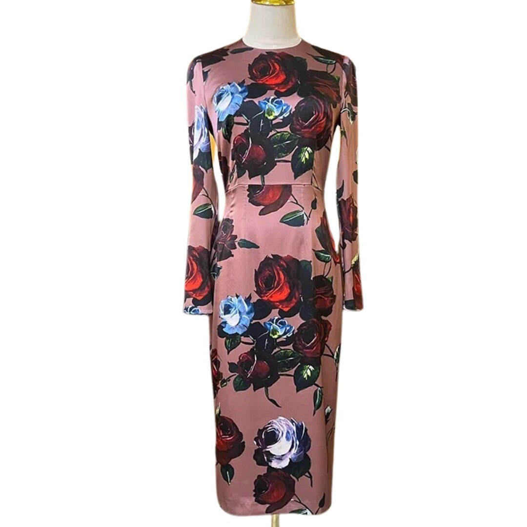 Floral long-sleeve dress in blush pink with red and blue roses, perfect for formal occasions.