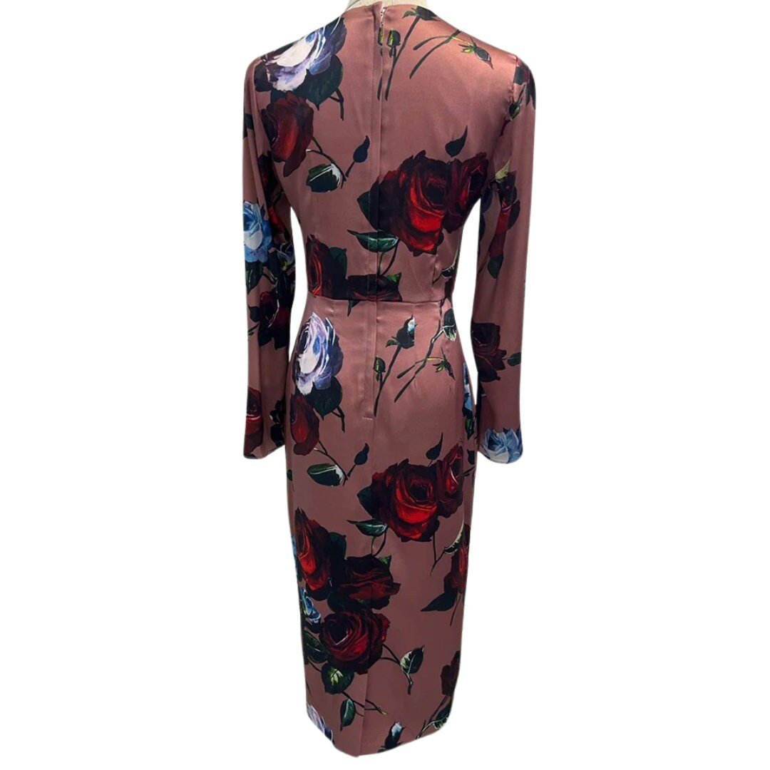 Elegant floral midi dress with long sleeves, featuring deep red and blue roses on a blush satin fabric.