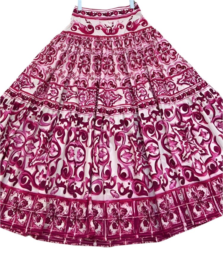 Full-length cotton skirt featuring a vibrant red and white Majolica print with tiered, voluminous design.