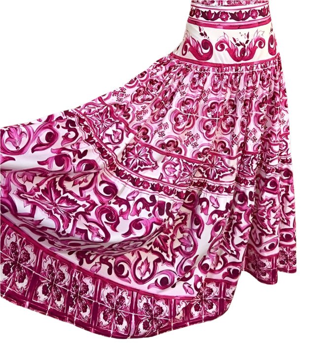 Red and white cotton maxi skirt featuring an ornate, flowing Majolica tile-inspired pattern and a flared silhouette.