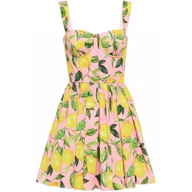 Pink sleeveless dress with lemon print, sweetheart neckline, and flared skirt, perfect for summer outings.