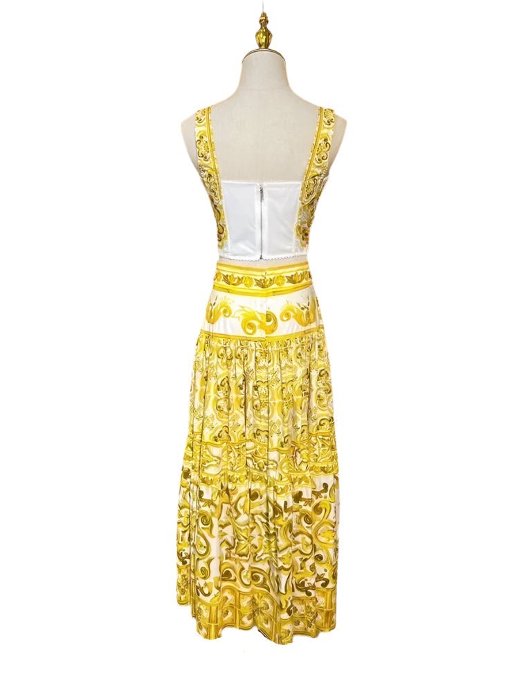 Back view of a yellow and white porcelain majolica print cotton two-piece set with a corset top and maxi skirt.