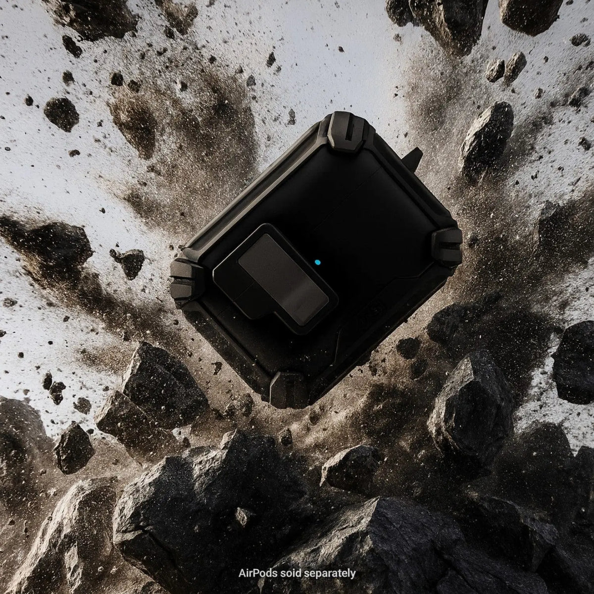 Rugged black AirPods Pro case with secure lock, suspended amid dramatic, exploding rock debris.