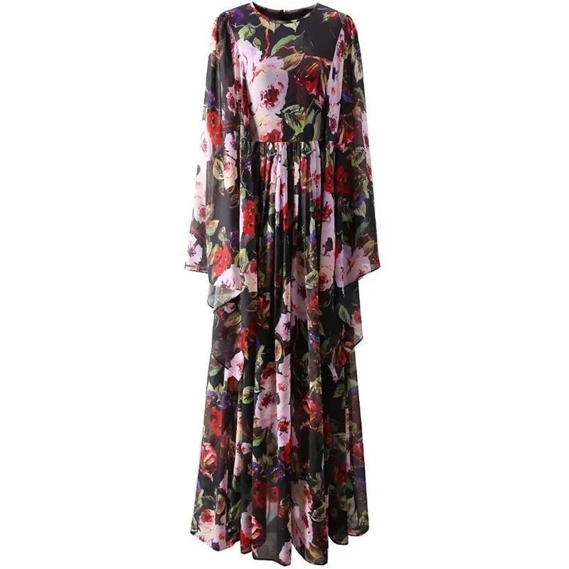 Floral maxi dress in black chiffon with long sleeves and a flowing skirt, featuring vibrant pink and red flowers.
