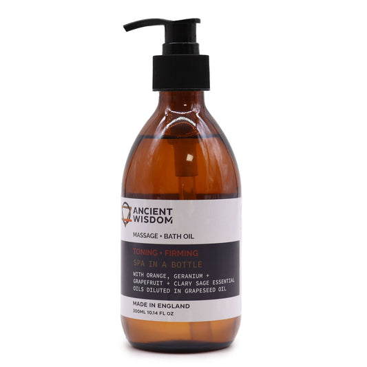 Botella de vidrio ámbar con dispensador negro y etiqueta blanca de aceite corporal tonificante y reafirmante.