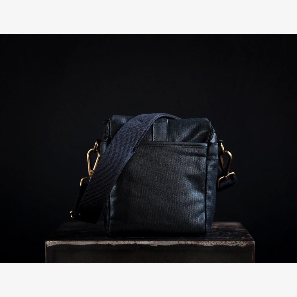 Rear and side pockets of waxed canvas camera bag Berlin – secure storage for notebook, batteries, and accessories