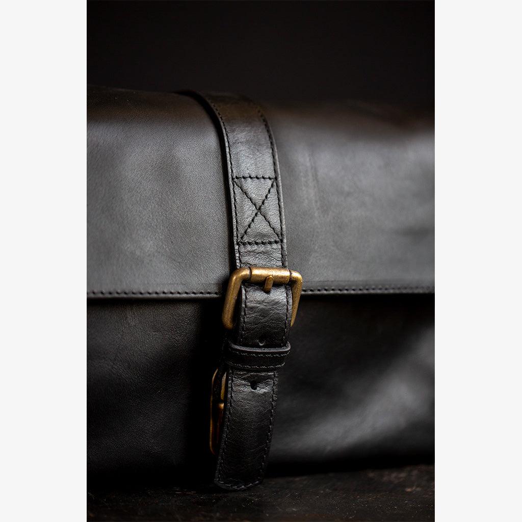 Paris black leather camera bag adjustable strap and artisanal stitching detail