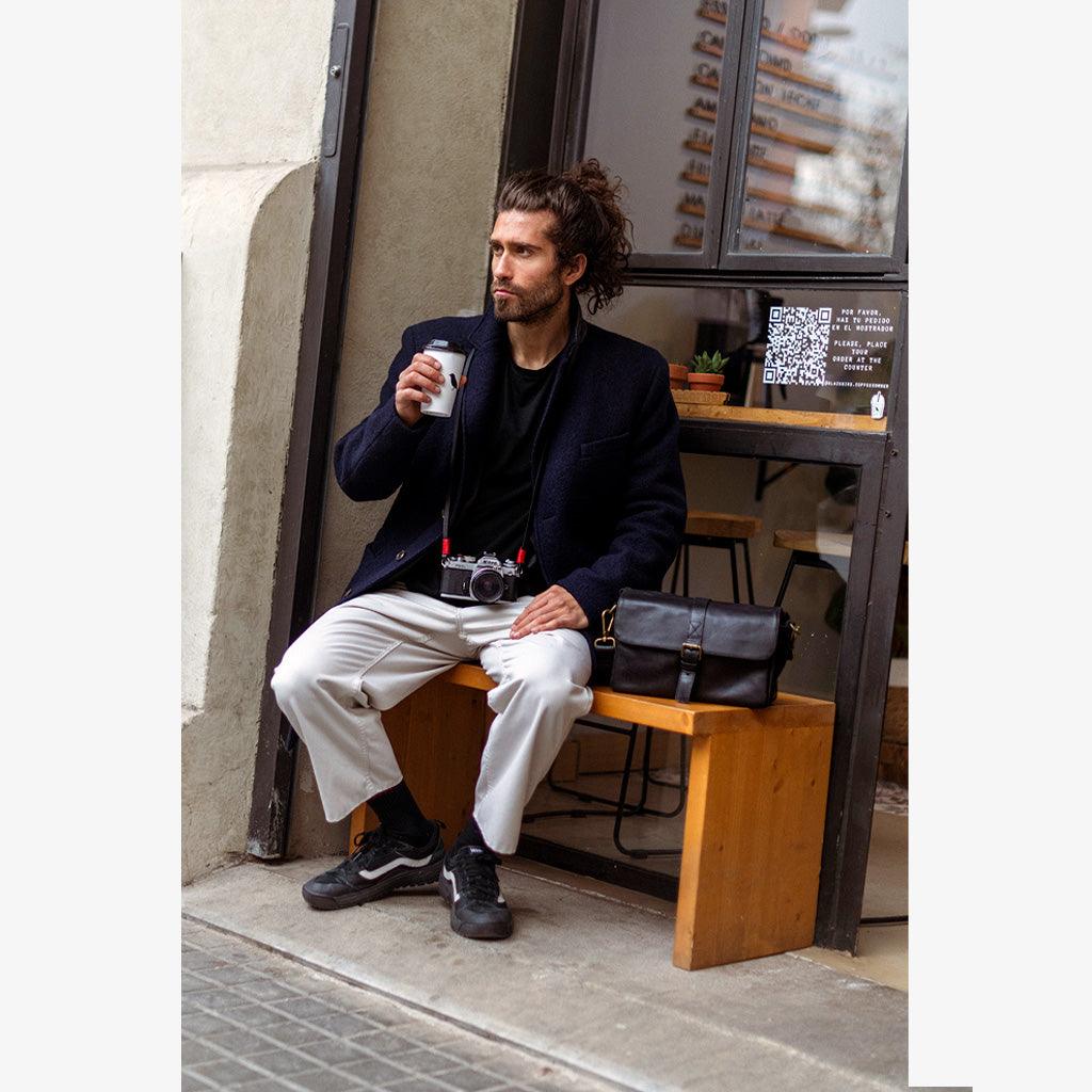 Paris black leather camera bag back pocket showing spacious design