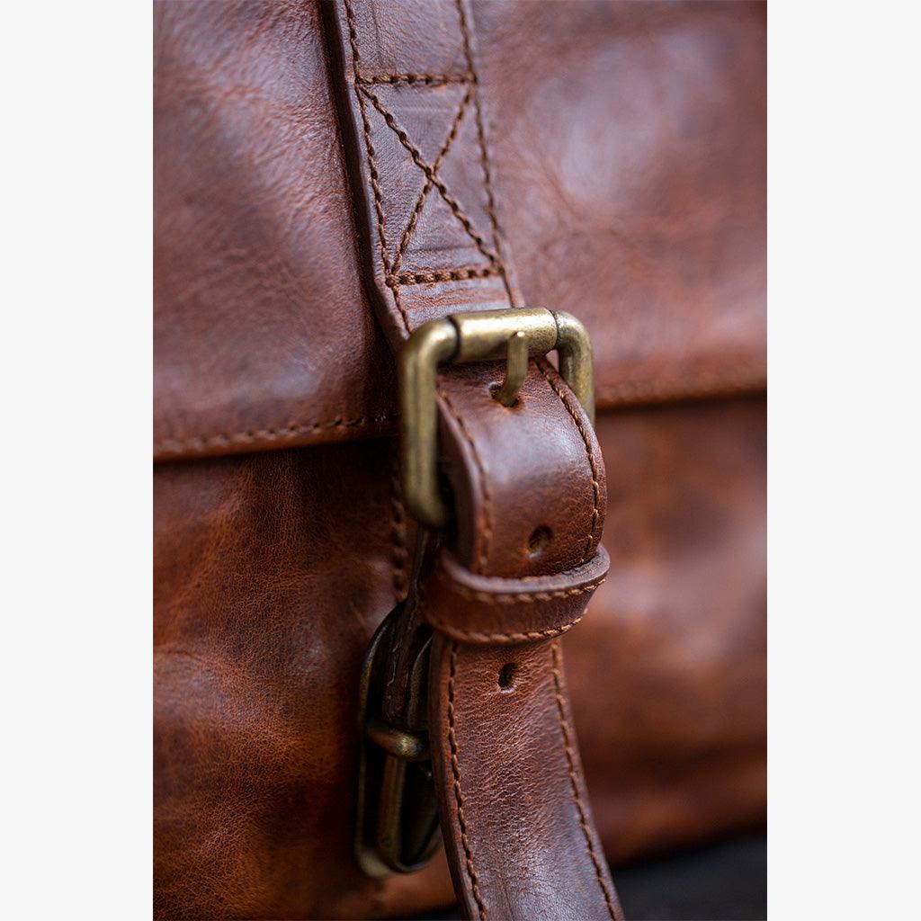Handmade leather camera bag featuring natural cognac leather finish