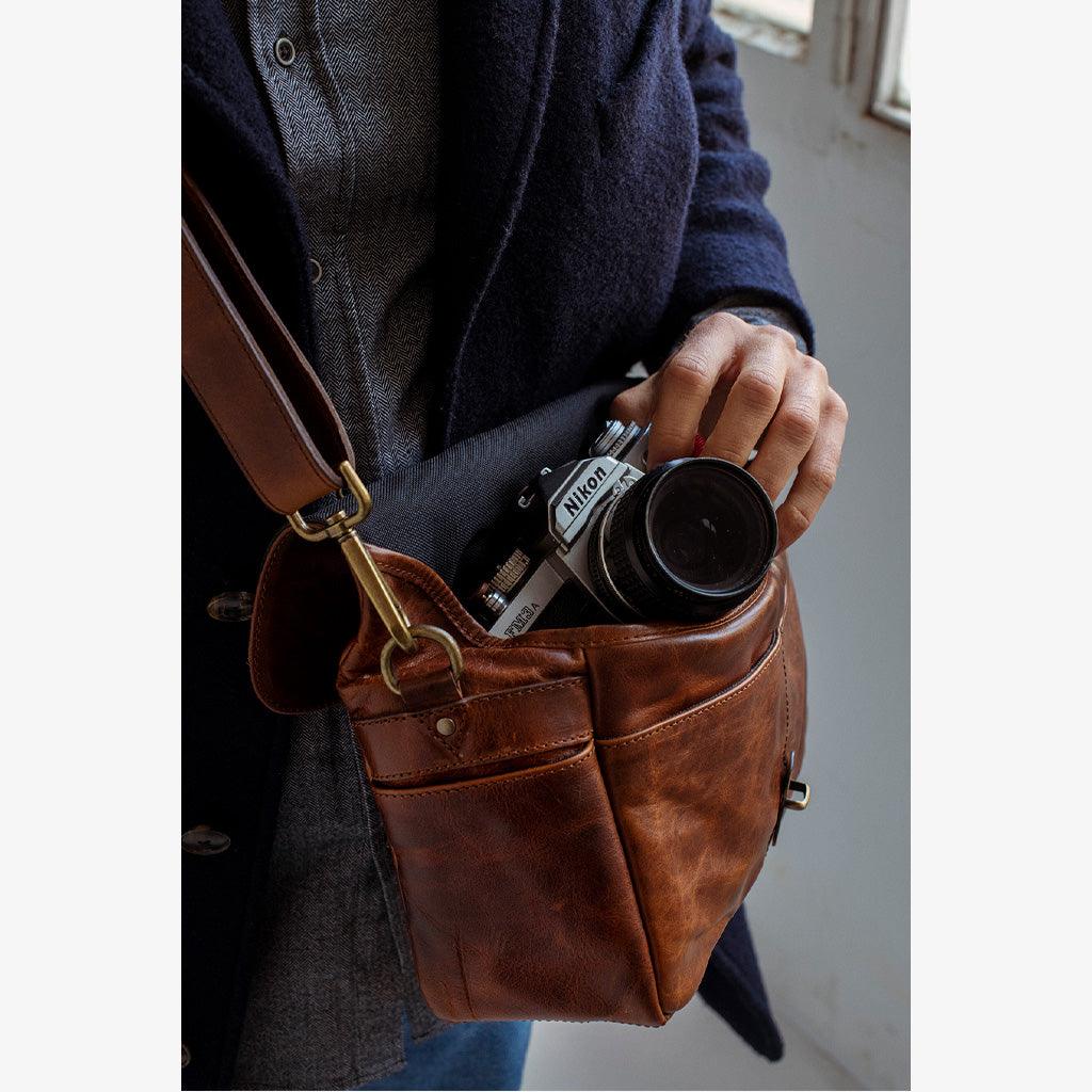 Handmade leather camera bag with multiple pockets for accessories