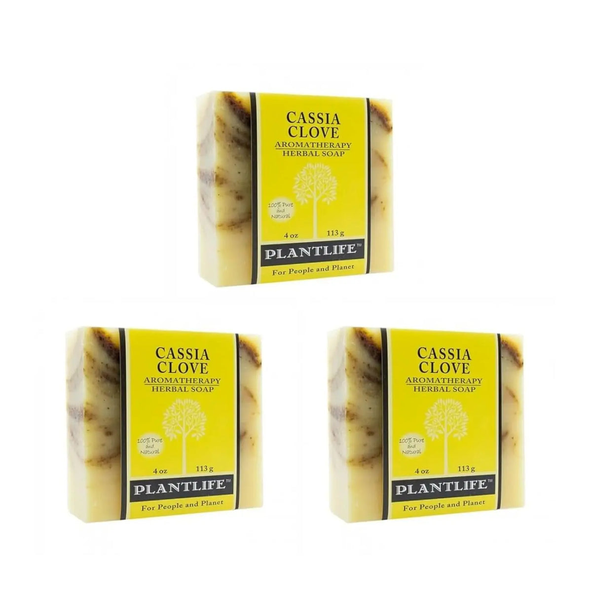Three bars of speckled Cassia Clove herbal soap wrapped in bright yellow paper labels with a tree logo.