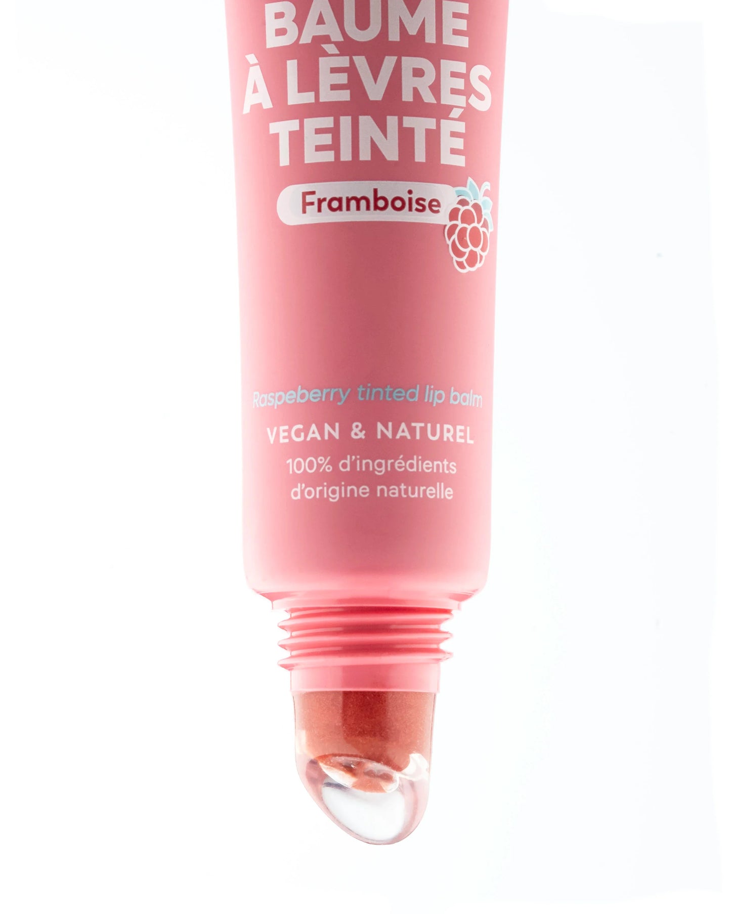 Pink tube of raspberry tinted lip balm with white text, a raspberry icon, and a clear slanted applicator tip.