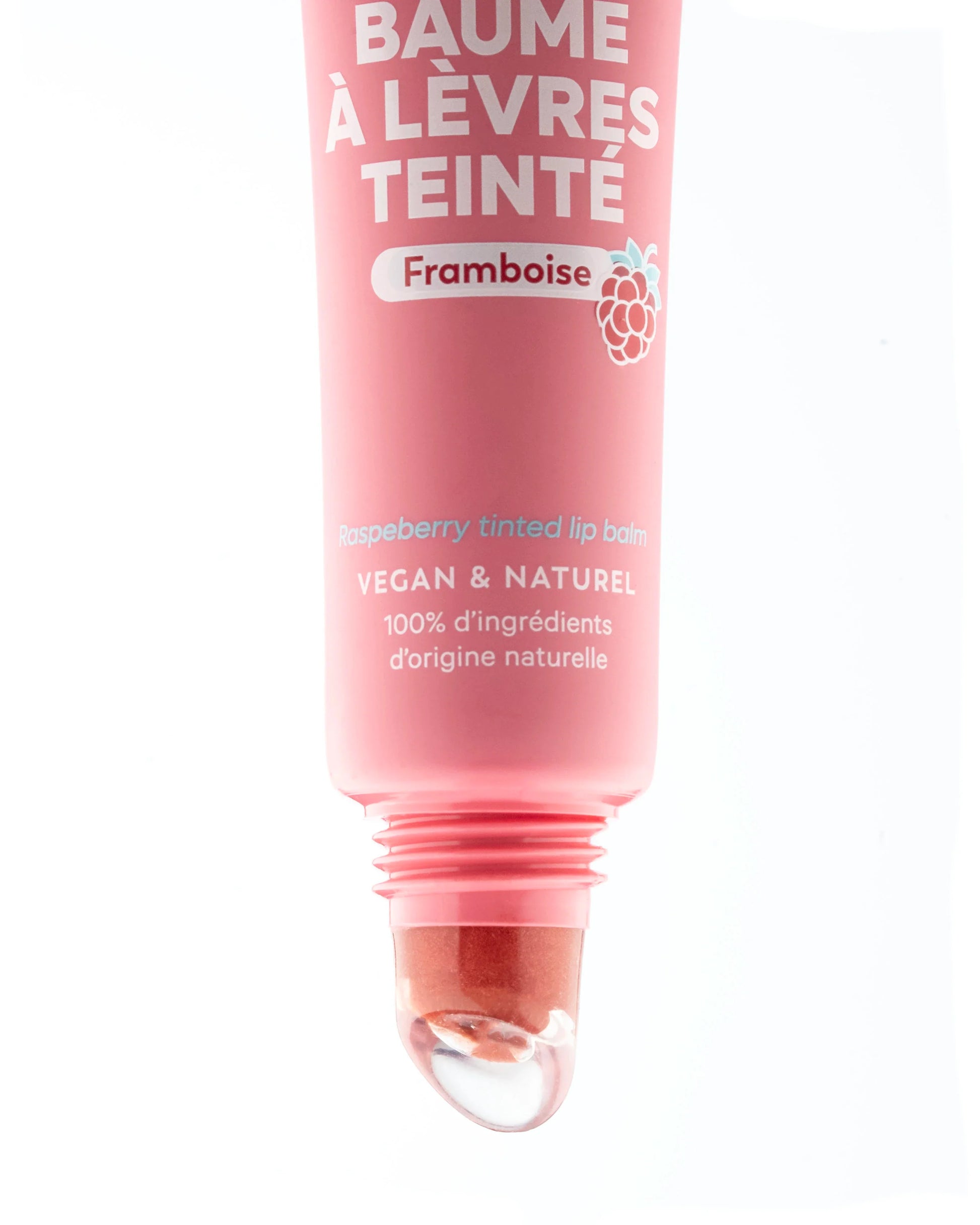 Pink tube of raspberry tinted lip balm with white text, a raspberry icon, and a clear slanted applicator tip.