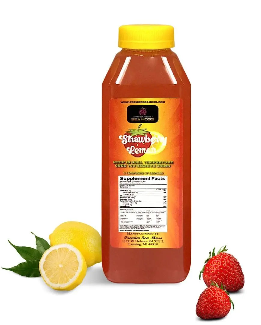 12 oz bottle of orange-colored strawberry lemonade with a yellow cap, flanked by fresh lemons and strawberries.