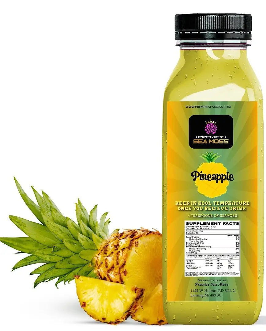 A 12oz bottle of yellow Sea Moss Pineapple lemonade with a black cap, featuring a pineapple graphic and nutrition label.
