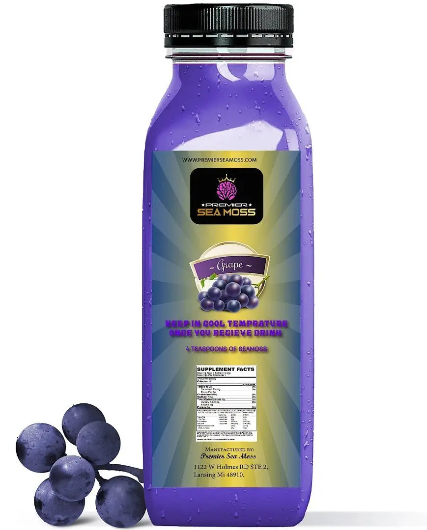 12oz bottle of purple grape-flavored sea moss drink with a black cap, featuring a product label and fresh grapes.
