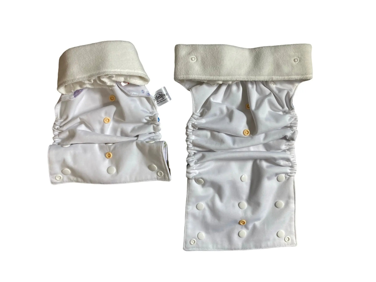 White cloth diaper cover and matching belt with interior snaps, elasticized legs, and soft fabric construction.